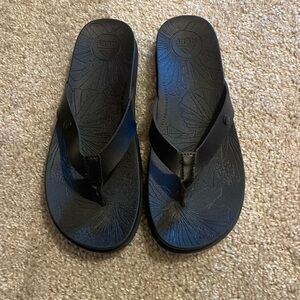 Black reef flip flops